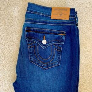 True Religion Skinny Jeans with frayed hem and button down fly.
